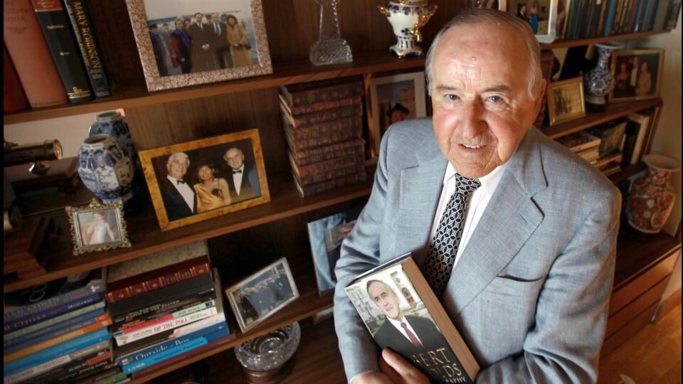 Former taoiseach Albert Reynolds photographed with a copy of his autobiography at his home. Photograph: Brenda Fitzsimons/The Irish Times