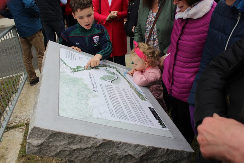 Luke and Anna Hurson examine the map of the new walkway. Photograph: Martin Byrne