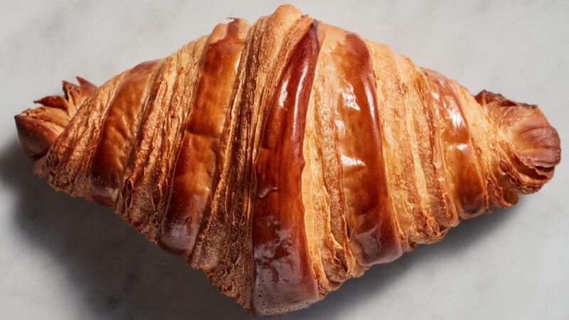 The burnished shell shatters and yields to the silky, bready, layered interior. Food Stylist: Laurie Ellen Pellicano. Photograph: Johnny Miller/The New York Times