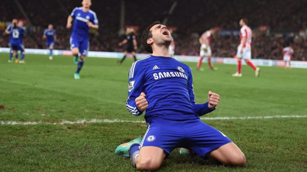 Chelsea’s Cesc Fabregas celebrates scoring his sides second goal of the game against Stoke City   at the Britannia Stadium. Photograph:  Martin Rickett/PA Wire