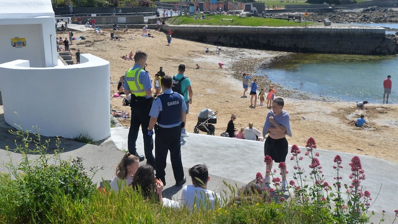 Gardaí check addresses of visitors to Sandycove after it and the Forty Foot reopened on Wednesday. Photograph: Alan Betson / The Irish Times