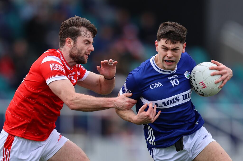 Louth's Dermot Campbell tackles Kevin Swayne of Laois. Photograph: Leah Scholes/Inpho