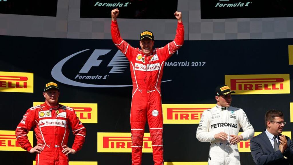 Sebastian Vettel celebrates winning the Hungarian Grand Prix in Budapest. Photo: Darko Bandic/AP