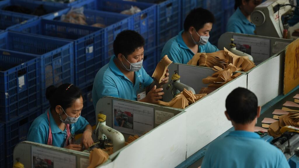 Workers on a production line at the Huajian shoe factory in Dongguan, China. Photograph: Greg Baker/AFP/Getty Images
