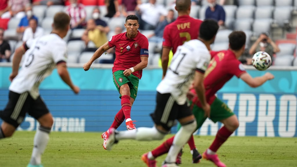 Cristiano Ronaldo shoots from a free kick during the Euro 2020 match against Germany. Photo: Matthias Schrader - Pool/Getty Images