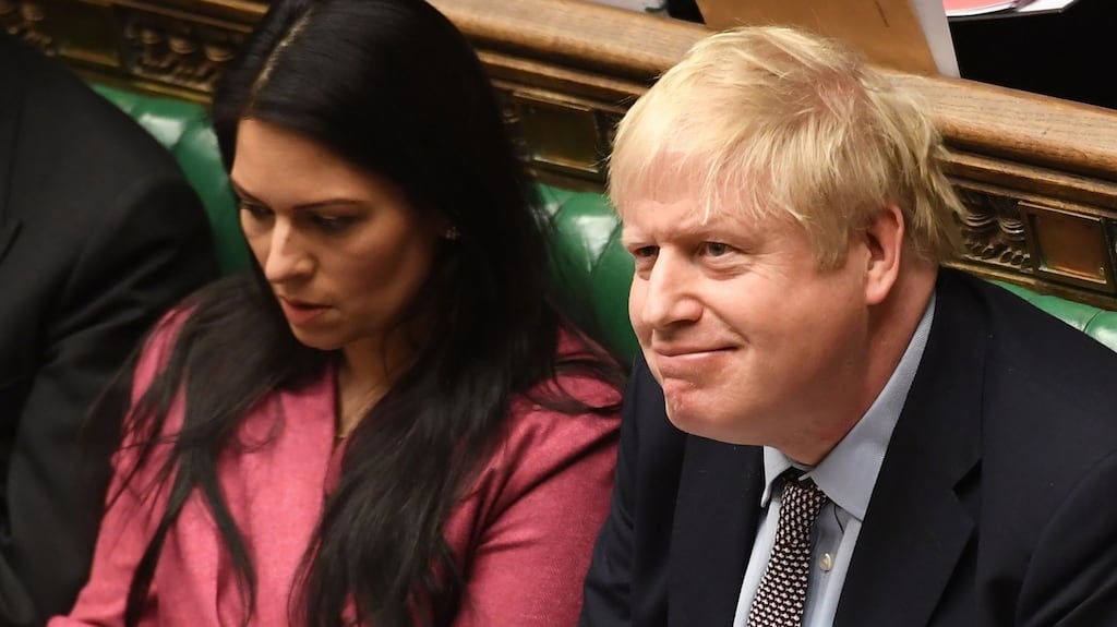 Britain’s prime minister Boris Johnson, flanked by home secretary Priti Patel, during prime minister’s questions in the House of Commons in London. Photograph: Jessica Taylor/UK parliament/AFP via Getty Images