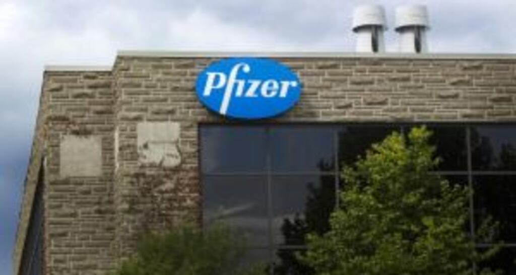 Pfizer tightened its full-year earnings forecast to between $2.23 and $2.27 per share from its prior outlook of $2.20 to $2.30