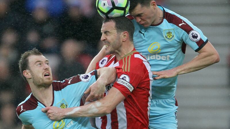 John O’Shea battles with Ashley Barnes and Michael Keane during their 0-0 Premier League draw. Photo: Richard Sellers/PA