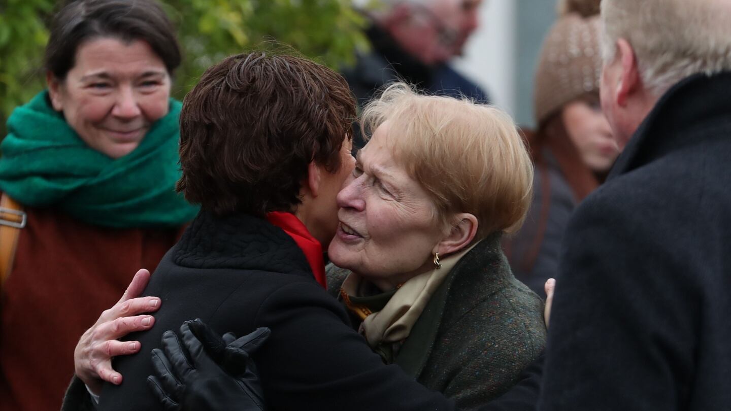 Daughter Orla Mallon (centre left) hugs Pat, the wife of former SDLP leader John Hume, after the funeral of Seamus Mallon. Photograph: Liam McBurney/PA