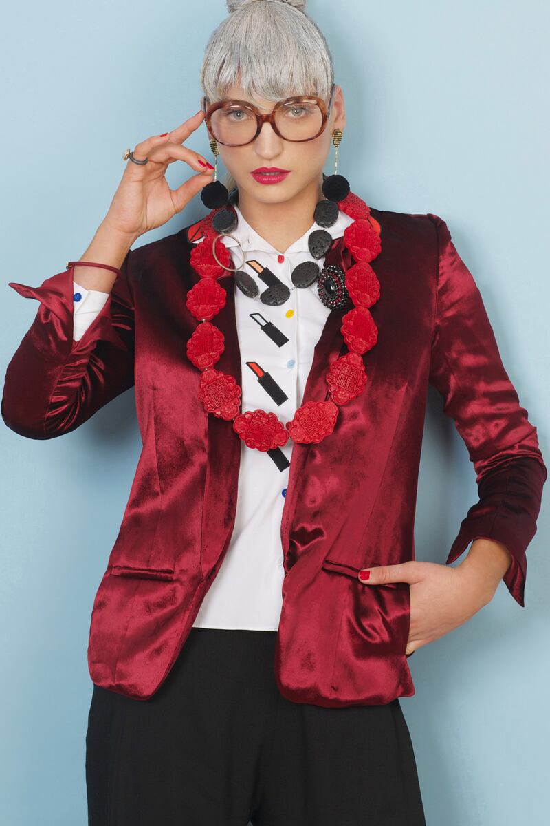 Jacket, €448, The Kooples. Blouse, €285, Alice & Olivia. Trousers €265, Vivienne Westwood, Brown Thomas. Pompom earrings €230, Mignonne Gavigan, Loulerie. Large red China Girl neckpiece €560, Melissa Curry. Black Lana stone neckpiece €295, Lynsey De Burca. Tube bracelet €55, Petra Meiren. Pearl ring €915, Mariann Anderson, Design Yard.