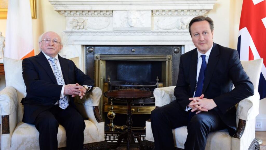 President Michael D. Higgins and British prime minister David Cameron are seen during a meeting at Downing Street in London today. Photograph: Andy Rain - Pool/Getty Images