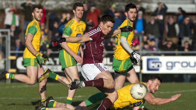 Donegal’s Leo McLoone tries to stop Galway’s Shane Walsh. Photograph: Evan Logan/Inpho