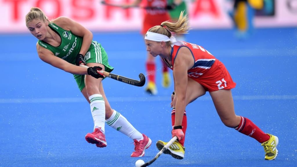 Chloe Watkins in action against the USA’s Nicole Woods during Ireland’s Women’s World Cup Pool B victory at Lee Valley Stadium, London. Photograph: Joe Toth/Inpho