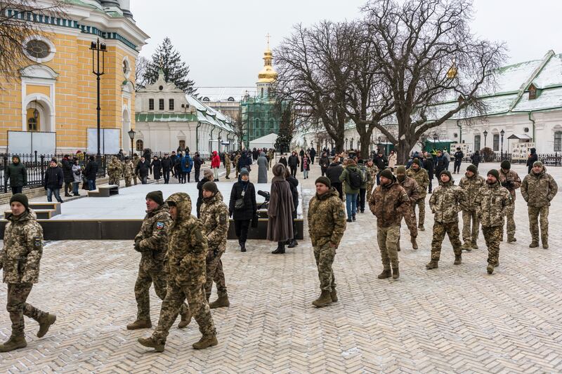 Ukrainian soldiers arrive for the Christmas liturgy service at the Holy Dormition Cathedral of the Kyiv-Pechersk Lavra, on Saturday. Photograph: Brendan Hoffman/The New York Times