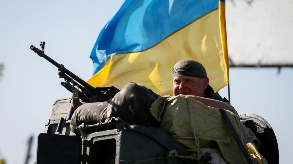 Ukrainian serviceman rides on an armoured vehicle near Slaviansk. Ukraine’s President Petro Poroshenko said on Wednesday he hoped a peace process for the troubled eastern region of his country to begin on Friday in the Belarussian capital Minsk and urged politicians to support the talks. Photograph: Gleb Garanich/Reuters