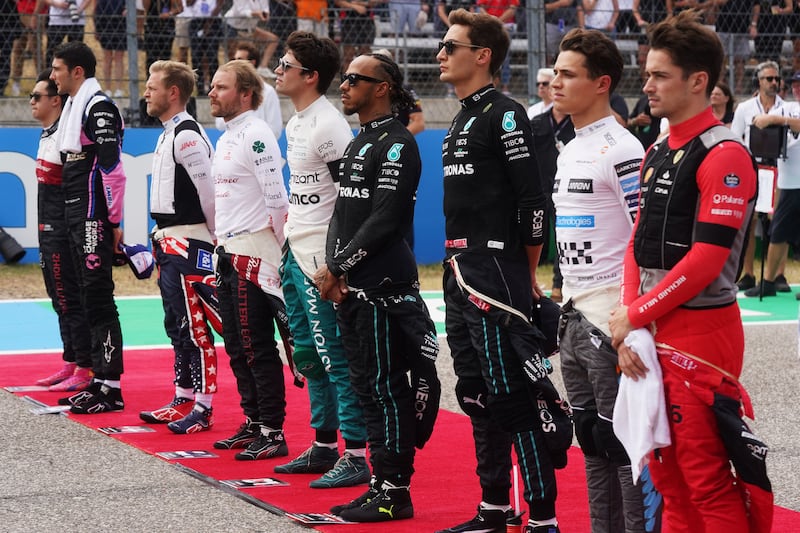 Formula One drivers Guanyu Zhou, Esteban Ocon, Kevin Magnussen, Valtteri Bottas, Lance Stroll, Lewis Hamilton, George Russell, Lando Norris and Charles Leclerc pause in memory of Red Bull owner Dietrich Mateschitz ahead of the US Grand Prix. Photograph: Shutterstock