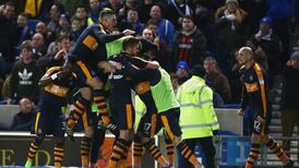 Newcastle take advantage of fluke goal at Brighton to go top