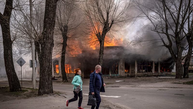 Residents run near a burning house following a shelling in Severodonetsk, Donbas, on April 6th. Photograph: Fadel Senna/AFP via Getty Images