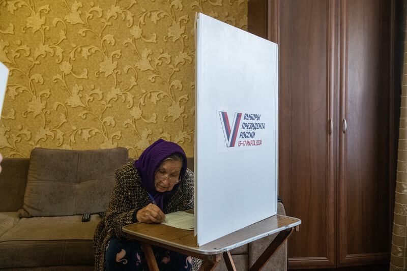 A woman votes at home during early voting in Russia's presidential election in Donetsk, Russian-controlled Ukraine. Photograph: Stringer/AFP/Getty Images