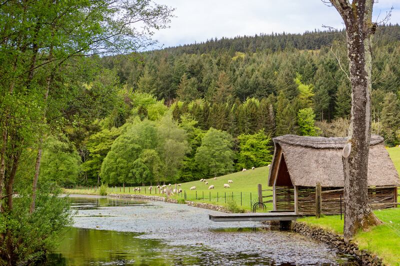 Thatched boathouse along the river