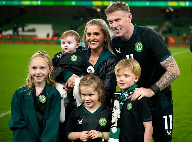 James McClean poses for photographs with his family after the final whistle. Photograph: Niall Carson/PA Wire