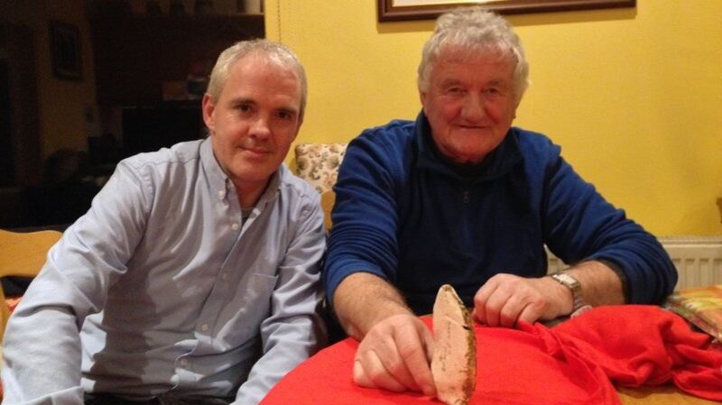 Vincent O’Brien and Noel McDonagh of Waterford History Group with a flint axe.
