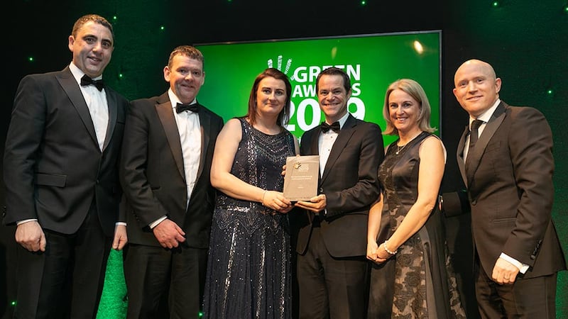 Mark Bennett, Country Manager, Talent Garden presents The Sustainable Energy Achievement Award to the AbbVie Team.