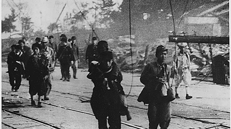 Survivors moving along the road after the atomic bombing of Nagasaki, Japan, in August 1945. Photograph: EPA/US national archives