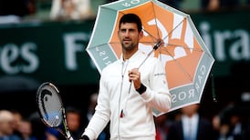 Agnieszka Radwanska crashes out in rain at French Open