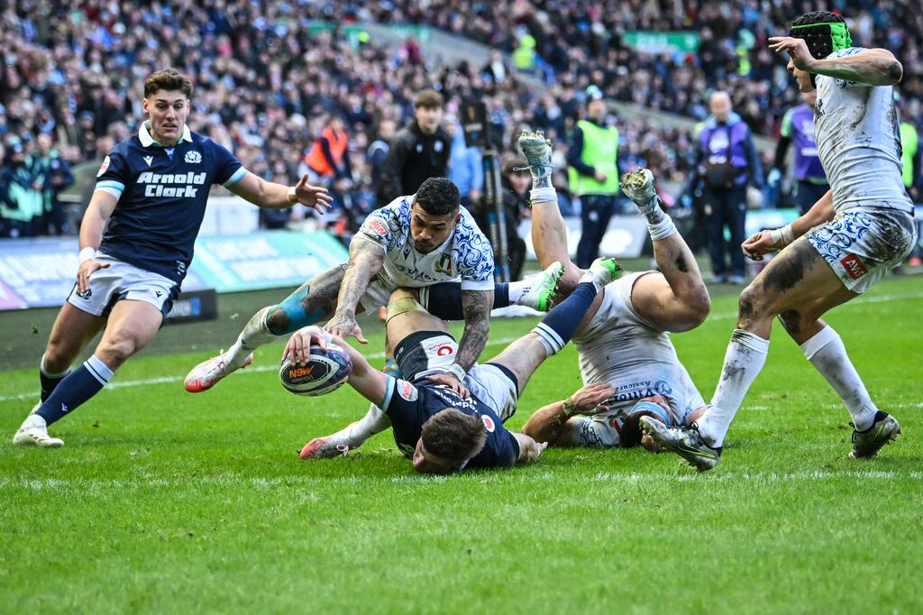 Scotland centre Huw Jones scores a try during the Six Nations match against Italy at Murrayfield. Photograph: Andy Buchanan/AFP via Getty Images