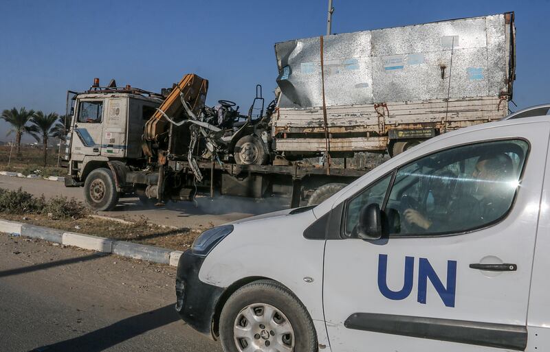 Gaza: A truck that was used by workers of the United Nations Relief and Works Agency for Palestine Refugees is loaded onto another truck after it was hit in an Israeli air strike. Photograph: Mohammed Saber/EPA
