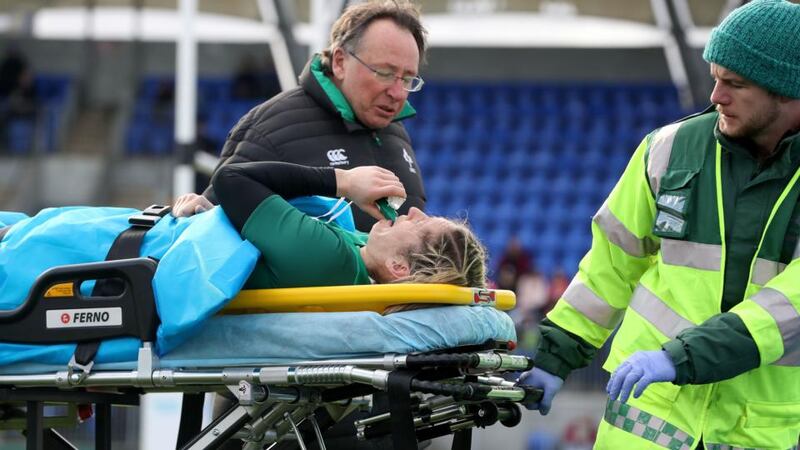 Ireland’s Alison Miller goes off injured after fracturing her ankle. Photo: Bryan Keane/Inpho