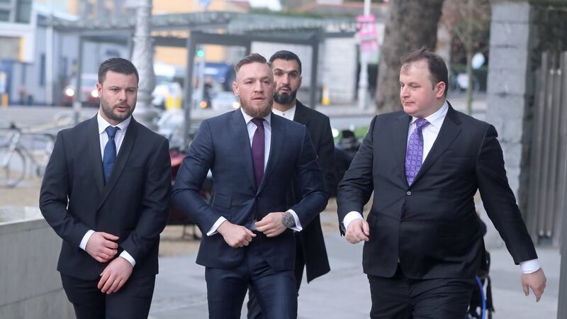 Conor McGregor (centre) arrives at Dublin District Court where he faced motoring charges. Photograph: Niall Carson/PA Wire