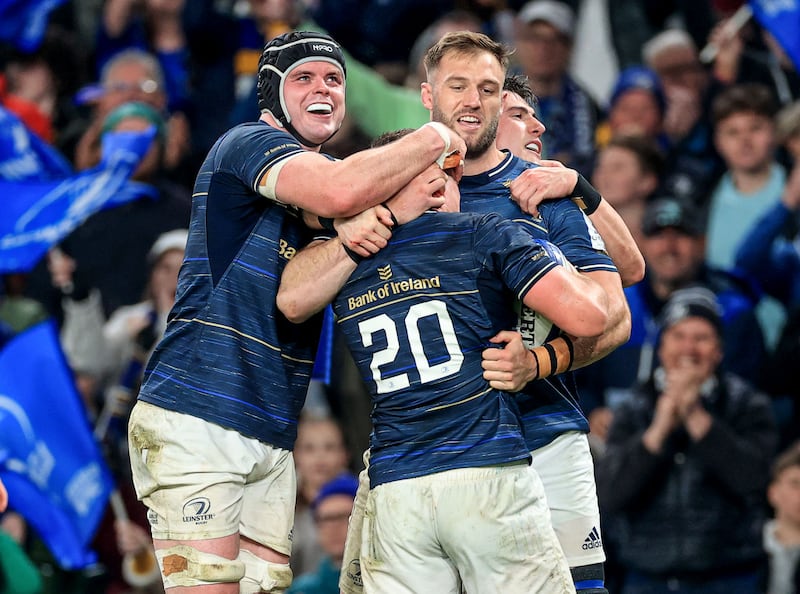 Scott Penny celebrates with Leinster team-mates James Ryan, Dan Sheehan and Jason Jenkins after scoring a try against Leicester Tigers at the Avival Stadium. Photograph: Dan Sheridan/Inpho