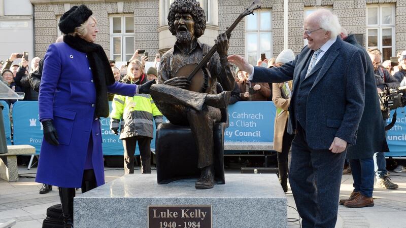 The President and wife Sabina after unveiling John Coll’s statue on South King Street, Dublin. Photograph: Dara Mac Donaill/The Irish Times