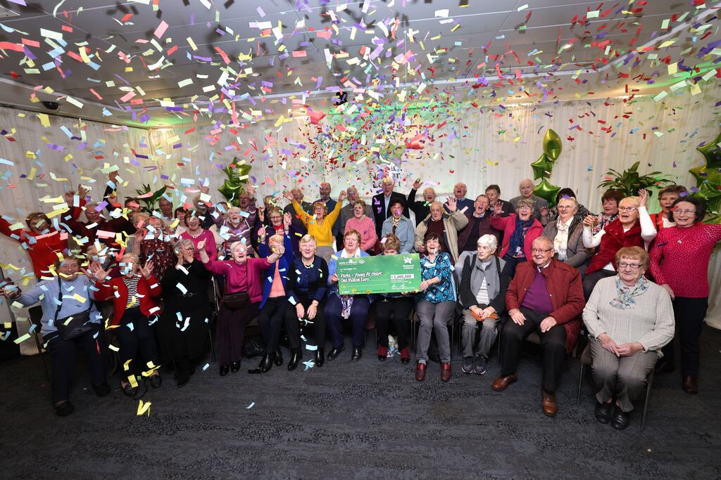 The Young at Heart retirement group syndicate collect their winnings at National Lottery Headquarters. Photograph: Dara Mac Dónaill