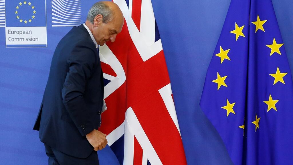 A worker arranges flags at the EU headquarters in Brussels. Photograph: Francois Lenoir/Reuters