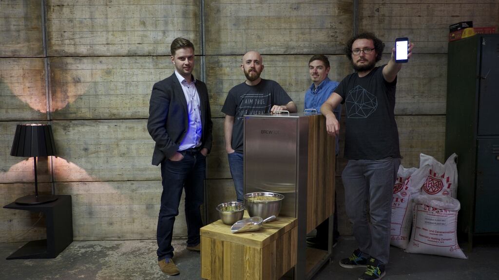 Chris McClelland, Jonny Campbell, Ali Sisk and Kieran Graham, the co-founders and creators of Brewbot, in the company’s workshop in Portadown, Co Armagh. Photograph: Paulo Nunes dos Santos for The New York Times
