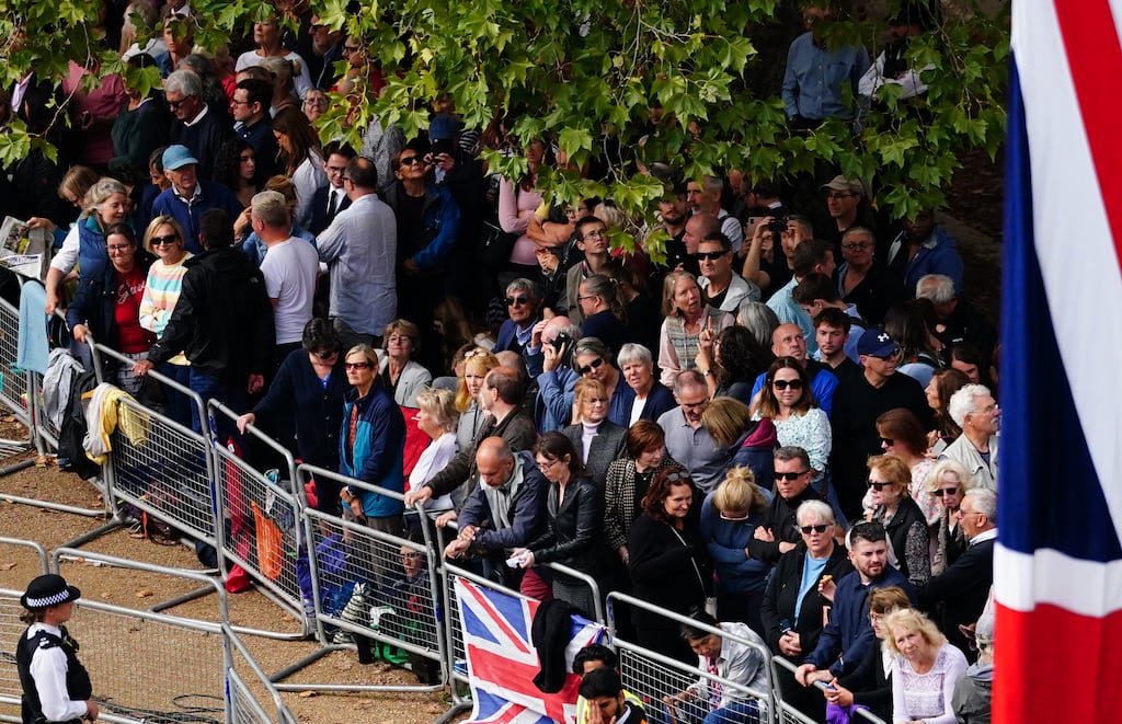 Crowds gather along the Mall ahead of the ceremonial procession of the coffin of Queen Elizabeth II from Buckingham Palace to Westminster Hall, London. Photograph: PA Images