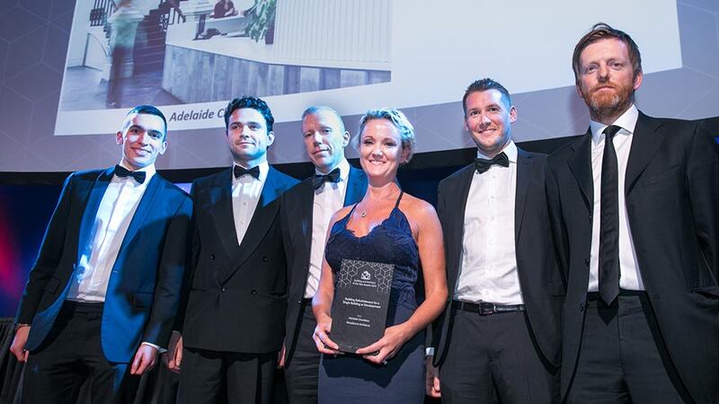 Claire Solon, Awards Judge presents the Building Refurbishment for a Single Building or Development award to the Broadstone Architects team.