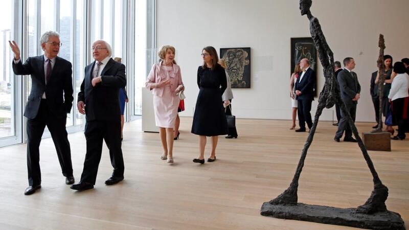 The Art Institute of Chicago Director Douglas Druick (L) tours with President Michael D. Higgins and his wife Sabina Higgins, The Art Institute of Chicago in Chicago, Illinois, USA. Photograph: Kamil Krzaczyniski/EPA