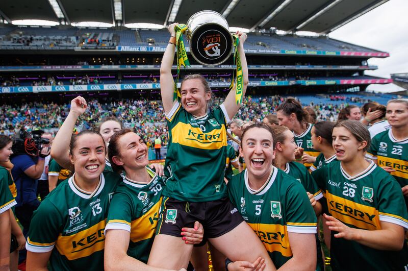 Kerry's Niamh Carmody with the Brendan Martin Cup is lifted by team-mates Cait Lynch and Aishling O'Connell after their win over Galway in the TG4 All-Ireland Ladies' SFC final at Croke Park in August. Photograph: Tom Maher/Inpho