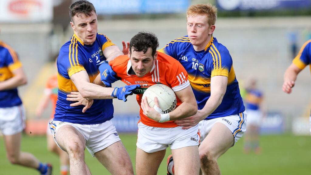 Armagh’s Jamie Clarke attempts to pass Tipperary’s Alan Campbell and Josh Keane. Photograph: Presseye/Philip Magowan