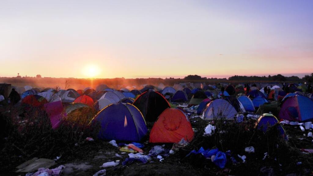 The sun rise behind a migrants’ make-shift camp near Roszke village on the Hungarian-Serbian border. Photograph: AFP/Getty Images