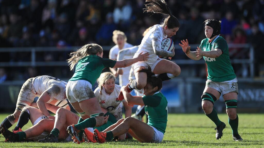 England’s Leanne Riley is tackled by Ireland’s Sene Naoupu during the match at Castle Park. Photo: Adam Davy/PA Wire.