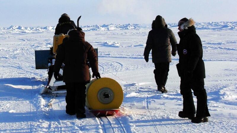The deployment by Wood Hole staff of the buoy in the Arctic in 2011. Photograph: Steven Lambert