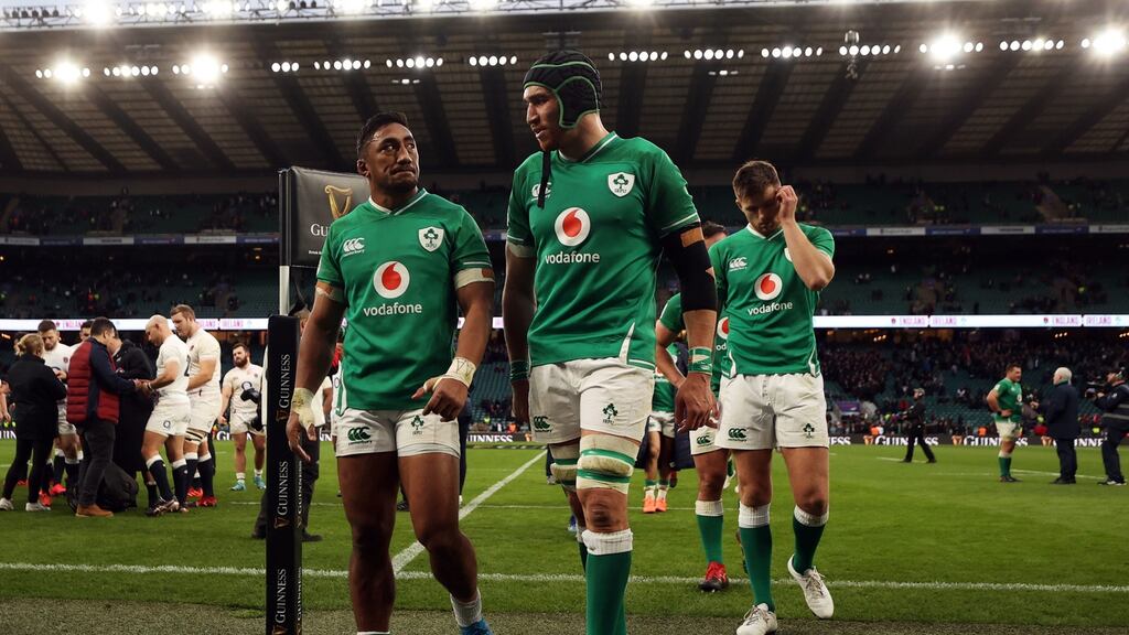 Ireland’s Ultan Dillane (right) and Bundee Aki leave the field dejected after their Six Nations loss to England at Twickenham. Photo: David Davies/PA Wire