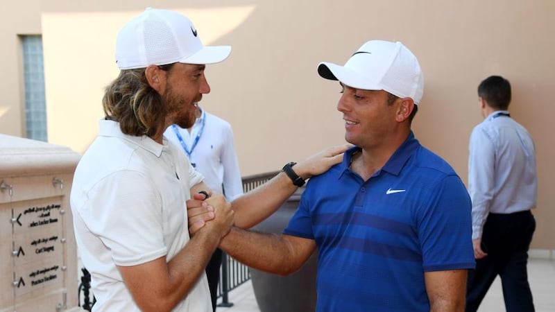 Tommy Fleetwood shakes hands with Francesco Molinari after the Italian had secured the Race to Dubai title. Photograph: Ross Kinnaird/Getty