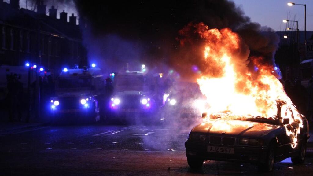 Unrest: a car burns in east Belfast after violence between, loyalists, nationalists and police in January. Photograph: Peter Muhly/AFP/Getty