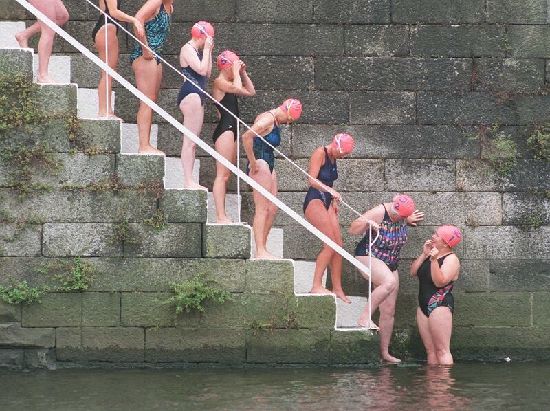 COMPETITORS WAITING BEFORE THE START OF THE LADIES SECTION OF THE ESB LIFFEY SWIM FROM WATLING STREET BRIDGE TO THE CUSTOM HOUSE ON SATURDAY. PICTURE : JOEY CLEARY